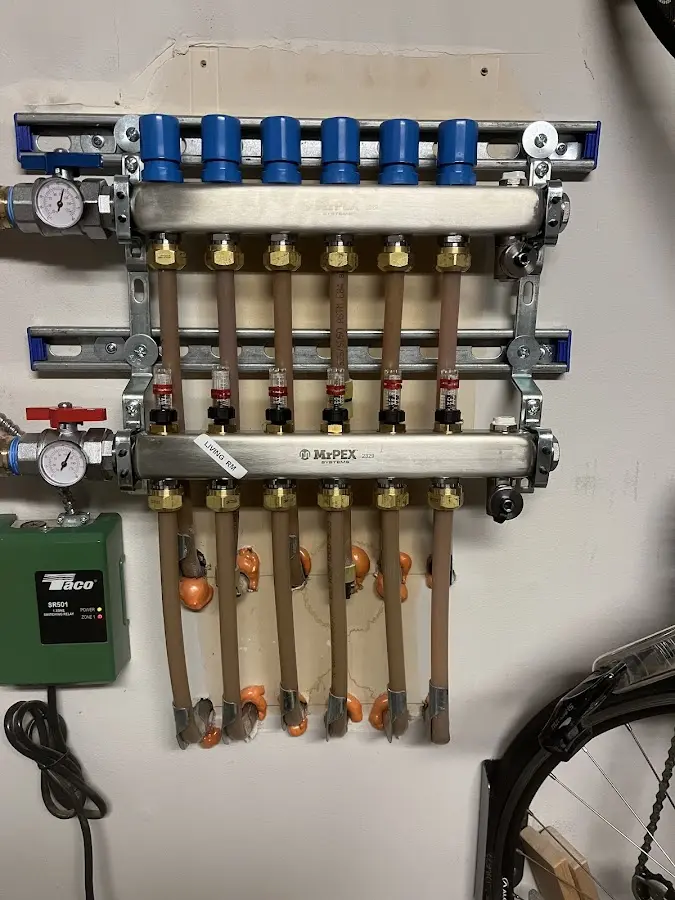 Plumber performing Water Heater Repair at a residential property in Blooming Grove